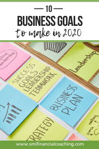 Business goals written on sticky notes on a table
