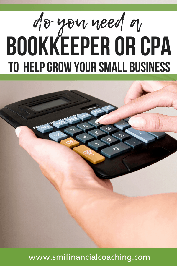 Small business CPA using a calculator