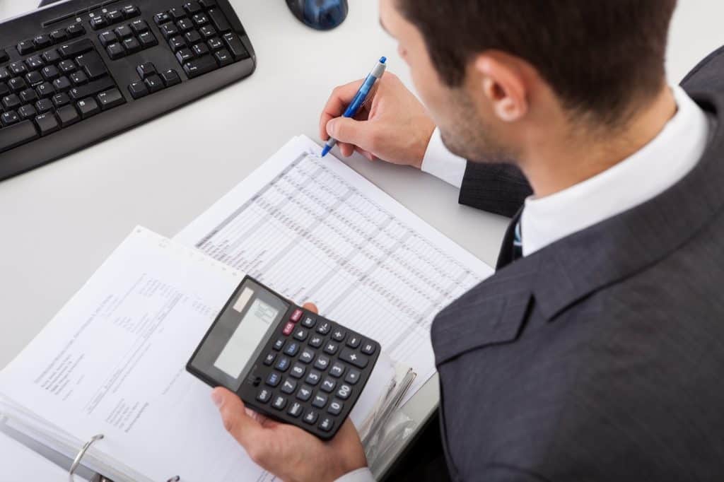 Small business accountant doing bookkeeping calculations