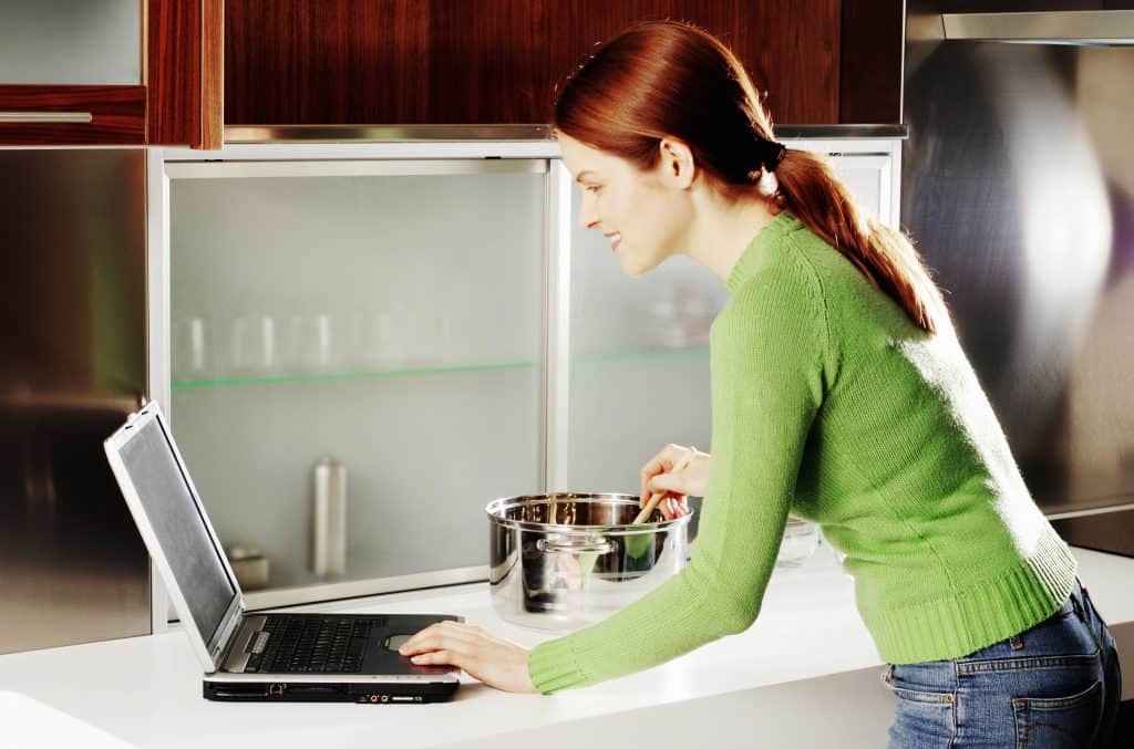 woman taking an online cooking course