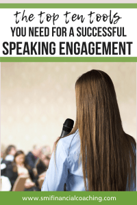 Woman with a speaking engagement taking to an audience